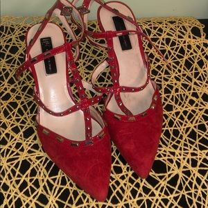 INC red suede pumps.